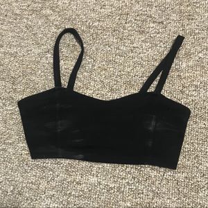 Black cropped top with lots of straps on the back